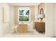 Bright home office with a modern desk, comfortable seating, and plenty of natural light at 11857 Sparkling Topaz Cv, Parrish, FL 34219