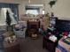 Cozy living room with a classic brick fireplace and natural light from the window at 12231 Fort King Rd, Dade City, FL 33525
