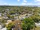 An aerial view of the property showcases the neighborhood and nearby waterways, with the city skyline in the distance at 1232 Sedeeva S Cir, Clearwater, FL 33755