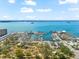 An aerial view shows neighborhood Marina, with stunning clear blue Gulf views and scenic walking paths at 1232 Sedeeva S Cir, Clearwater, FL 33755