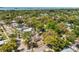 Charming single-Gathering home nestled among lush trees in a quiet residential neighborhood with water views in the distance at 1232 Sedeeva S Cir, Clearwater, FL 33755