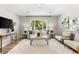 Neutral living room with natural light, accent pillows and stylish decor at 1232 Sedeeva S Cir, Clearwater, FL 33755
