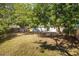 Large fenced backyard with mature trees providing plenty of shade at 12597 Cumberland Dr, Largo, FL 33773