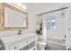 Bathroom features a new vanity, light fixtures, shower, and updated features at 12597 Cumberland Dr, Largo, FL 33773