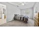 Comfortable bedroom with neutral tones, soft carpet, and a spacious layout at 12597 Cumberland Dr, Largo, FL 33773