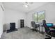 Bright bedroom with a comfortable desk, carpet flooring, and ample natural light at 12597 Cumberland Dr, Largo, FL 33773