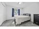 Comfortable bedroom with carpet flooring, soft lighting, and relaxing space at 12597 Cumberland Dr, Largo, FL 33773