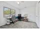 Spacious bedroom featuring a desk, carpet flooring, and ample natural light at 12597 Cumberland Dr, Largo, FL 33773