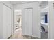 Hallway showcasing access to bathroom and bedroom, connecting spaces within the home at 12597 Cumberland Dr, Largo, FL 33773
