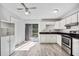 Bright kitchen with stainless appliances and sliding door access to the backyard at 12597 Cumberland Dr, Largo, FL 33773