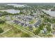 Wide aerial view of a well-planned community featuring beautiful homes and lake views at 13460 Bergamont Cir, Tampa, FL 33618
