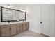 Bathroom featuring a large double sink vanity with sleek fixtures and a modern design aesthetic at 13460 Bergamont Cir, Tampa, FL 33618