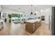 Open-concept kitchen with a large island, modern appliances, and seamless flow to living spaces at 13460 Bergamont Cir, Tampa, FL 33618