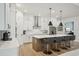 Elegant kitchen featuring a large island with seating and sleek, modern appliances at 13460 Bergamont Cir, Tampa, FL 33618
