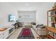 Cozy living room with modern decor, area rug, and lots of natural light at 13460 Bergamont Cir, Tampa, FL 33618