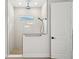 Modern shower with a rain shower head, glass enclosure, and a small window for natural light at 13460 Bergamont Cir, Tampa, FL 33618