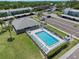Aerial view of the community pool and clubhouse with parking at 135 Nina Way # 35, Oldsmar, FL 34677