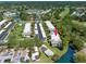 An aerial view of a condo community next to a canal with lush greenery at 135 Nina Way # 35, Oldsmar, FL 34677