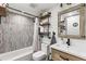 Modern bathroom featuring black hardware, open shelving and decorative backsplash at 135 Nina Way # 35, Oldsmar, FL 34677