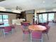 Clubhouse interior with multiple tables and chairs plus a refreshment area at 135 Nina Way # 35, Oldsmar, FL 34677