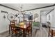 Cozy dining room featuring a wooden table, chandelier, and decor at 135 Nina Way # 35, Oldsmar, FL 34677