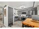 A recently renovated kitchen featuring stainless steel appliances and stylish gray cabinets with wood-look flooring at 135 Nina Way # 35, Oldsmar, FL 34677