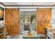 Lanai featuring barn door access to living room, with outdoor seating at 135 Nina Way # 35, Oldsmar, FL 34677