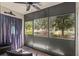 Screened in lanai providing a relaxing outdoor space with ceiling fan at 135 Nina Way # 35, Oldsmar, FL 34677