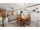 Bright living room with barn door access to lanai, comfortable seating, and modern decor at 135 Nina Way # 35, Oldsmar, FL 34677