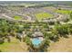 Birds eye view of a community featuring a pool, clubhouse, and green spaces at 13675 Paddington Way, Spring Hill, FL 34609