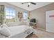 Bright bedroom featuring natural light and a workspace at 13675 Paddington Way, Spring Hill, FL 34609