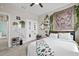 Bedroom with unique tapestry, decorative wall hangings, and carpeted floors at 13675 Paddington Way, Spring Hill, FL 34609