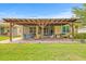 Large covered patio with seating, offering an ideal space for outdoor relaxation and entertaining at 13675 Paddington Way, Spring Hill, FL 34609