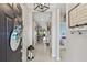 Welcoming foyer with bright lighting, elegant décor, and a view into the rest of the home at 13675 Paddington Way, Spring Hill, FL 34609