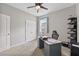 Bright office features modern desk with ceiling fan at 13675 Paddington Way, Spring Hill, FL 34609