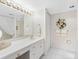 Bright bathroom offers a large mirror and generous countertop space at 1400 Gulf Blvd # 511, Clearwater Beach, FL 33767