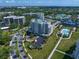Aerial view showcases the condos, pools, and grounds, underlining the community's blend of luxury and leisure at 145 Belleview Blvd # 201, Belleair, FL 33756