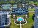 Luxury condos with lush lawns and palm trees, showcasing pool and resort-style amenities, and manicured landscaping at 145 Belleview Blvd # 201, Belleair, FL 33756