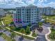 Aerial shot of a modern condo building showcasing its architectural design and private outdoor space, circled in pink at 145 Belleview Blvd # 201, Belleair, FL 33756