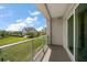 Cozy balcony area overlooking a lush grassy area and well-manicured lawns at 145 Belleview Blvd # 201, Belleair, FL 33756