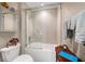 Bright bathroom featuring a shower over tub and modern fixtures at 145 Belleview Blvd # 201, Belleair, FL 33756