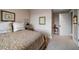 Bedroom featuring wall art, neutral colored walls, and soft carpeting at 145 Belleview Blvd # 201, Belleair, FL 33756