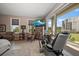 Bright bedroom features a seating area, balcony access with lovely views at 145 Belleview Blvd # 201, Belleair, FL 33756