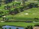 Scenic view of a lush green golf course with sand traps and trees at 145 Belleview Blvd # 201, Belleair, FL 33756