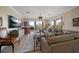 Living room with a comfortable seating area, a large flatscreen TV, and sliding doors to a beautiful patio at 145 Belleview Blvd # 201, Belleair, FL 33756