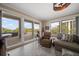 Well-decorated living room with lots of natural light coming in from sliding doors to a beautiful patio at 145 Belleview Blvd # 201, Belleair, FL 33756
