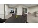 Outdoor patio seating area with a grill and sliding glass doors at 145 Belleview Blvd # 201, Belleair, FL 33756