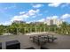 Comfortable patio with lounge chairs and a beautiful view of the area at 145 Belleview Blvd # 201, Belleair, FL 33756
