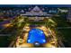 Aerial view of a luxurious pool and seating area at night at 145 Belleview Blvd # 201, Belleair, FL 33756