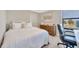 Inviting bedroom with a comfortable bed, dresser, and window view, creating a cozy and relaxing atmosphere at 1476 Fort Cobb Ter, Wesley Chapel, FL 33543